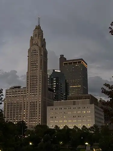 Urban elegance under a dramatic twilight sky.
